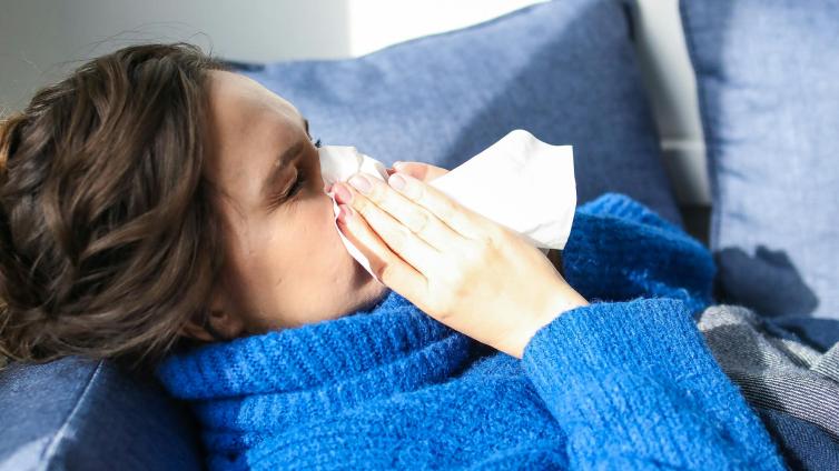 Sick and blowing nose